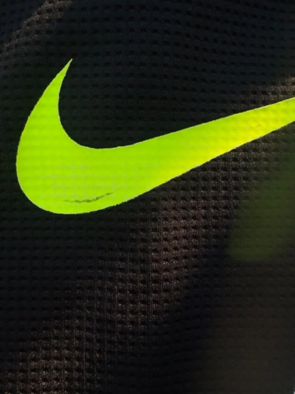 Nike Dri-FIT hoodie featuring a neon yellow swoosh logo and baseball stitching